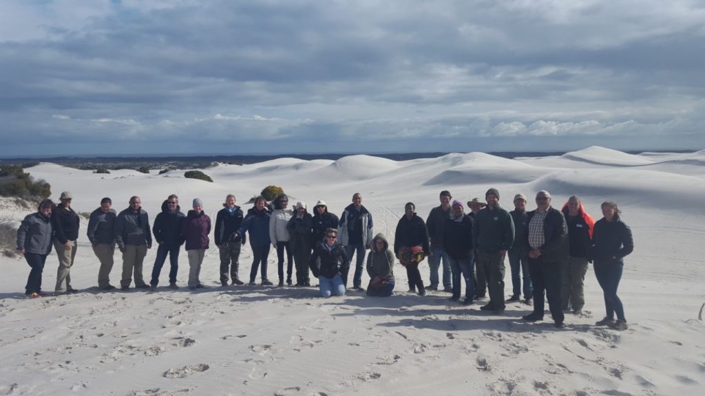 Open Standards workshop participants gather at the Witzands dune system. 